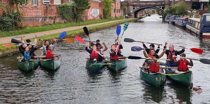 Group of young Carers in Canoes