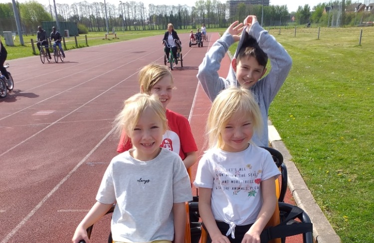 Four young carers in a go-kart