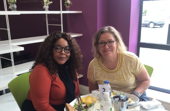 Happy Women in Cafe