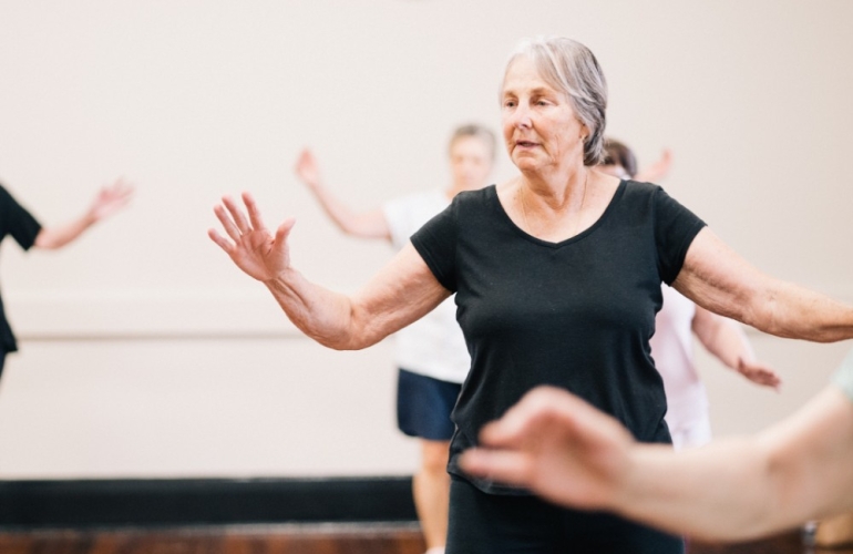 Woman dancing in a class and getting active and moving